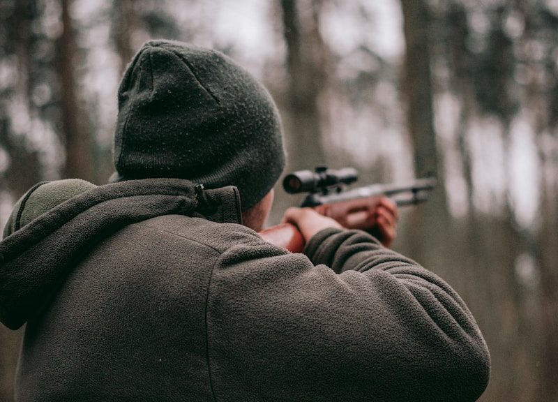 man using sniper rifle