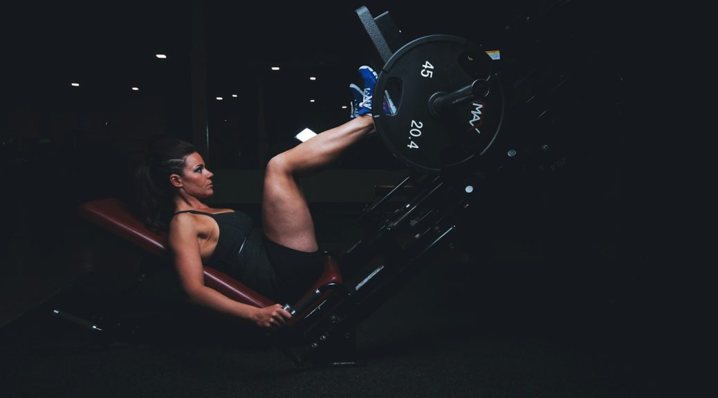 woman on gym equipment